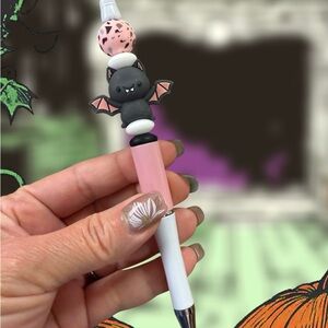 Pink and White Bat-Themed Pen
